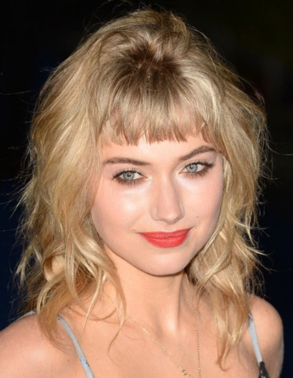 Imogen Poot’s Medium Wavy Hairstyle with Baby Bangs