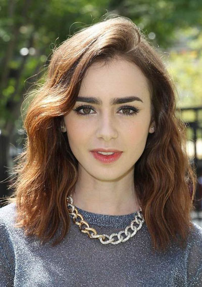 Lily Collins’ Trendy Wavy Shoulder Length Hairstyle