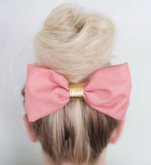 Blonde Hair In Ballerina Bun With Large Hair Bow Accent
