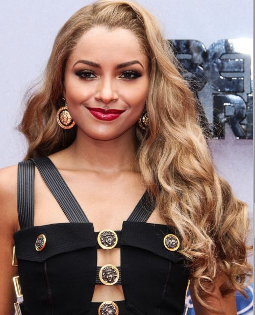 Kat Graham's Long Loose Curly Hair With Heavy Blonde Highlights