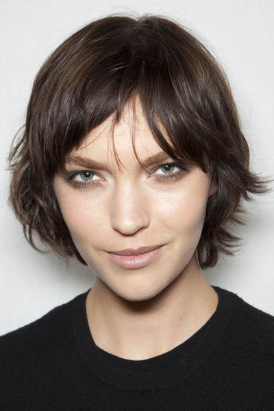 Short Brunette Hair In Choppy Layered Hairstyle With Bangs